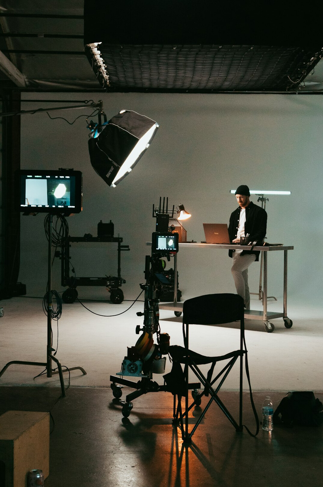 cinematographer adjusting film lights