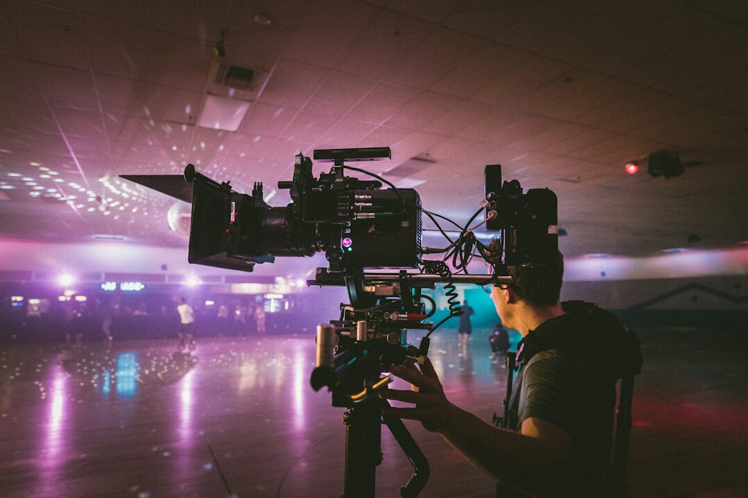 cinematographer adjusting film lights
