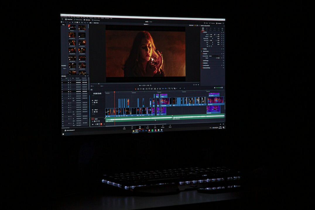 video editor working on computer