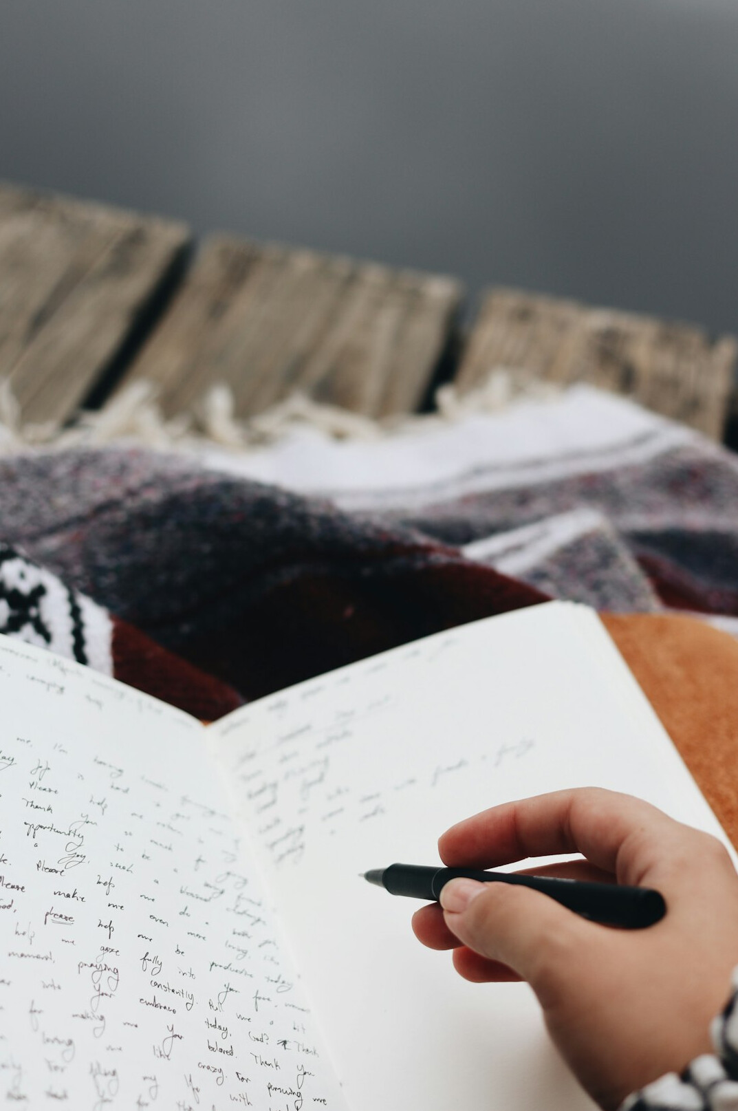 person writing screenplay notes