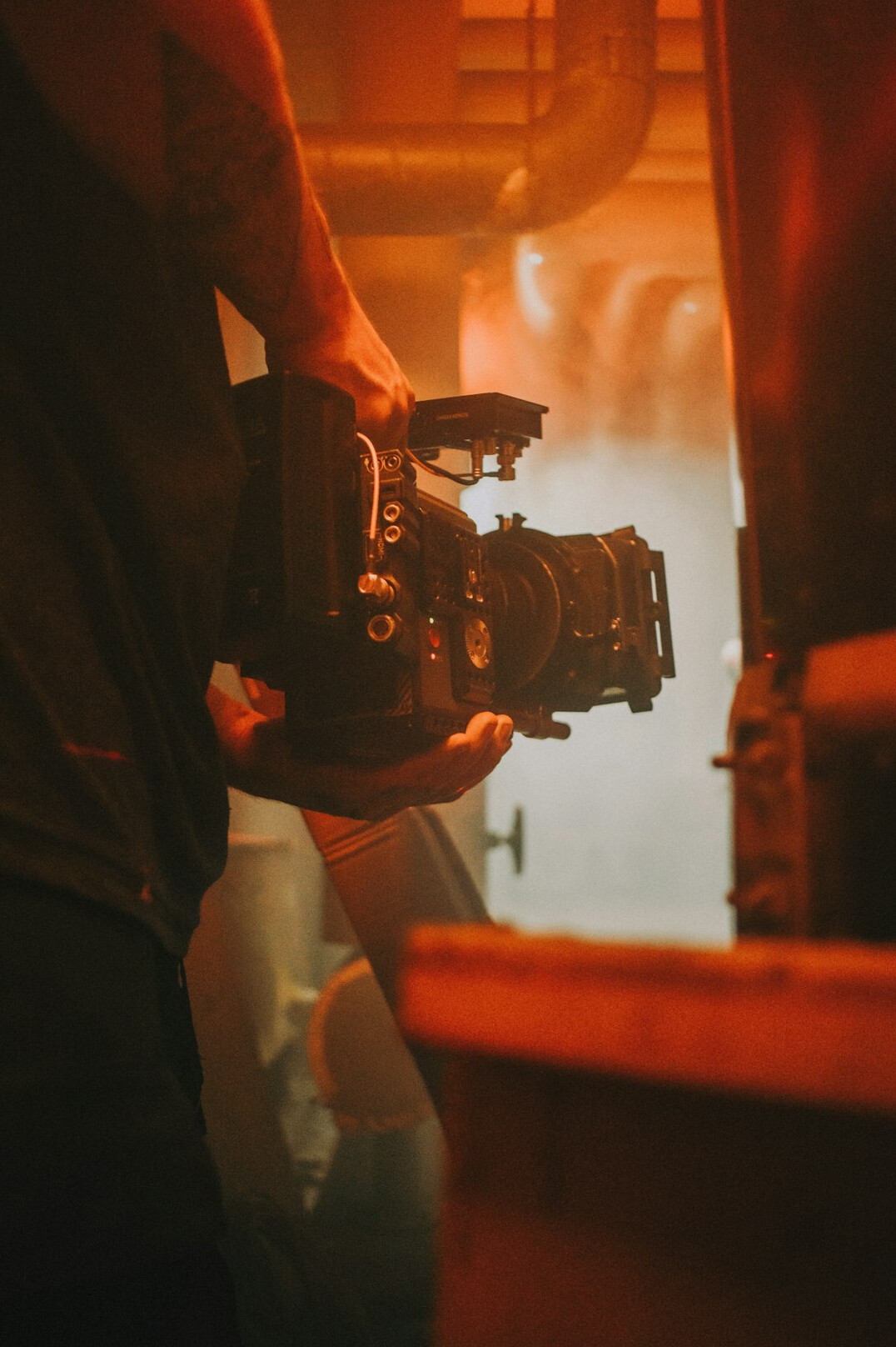 filmmaker holding camera on set